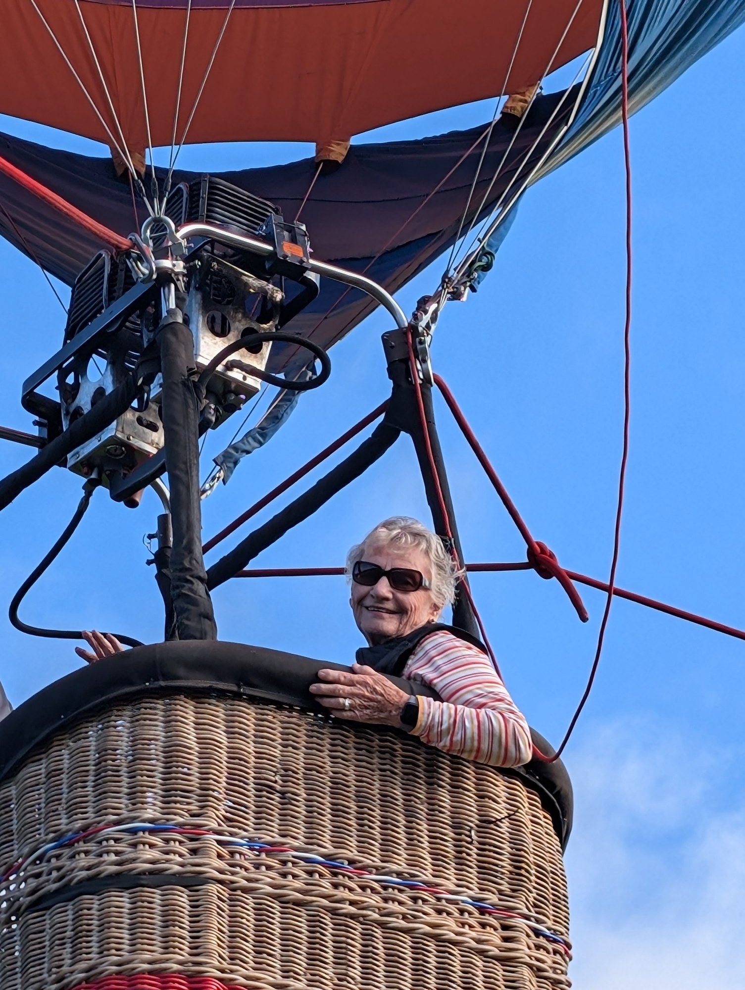A resident standing in a hot air balloon basket